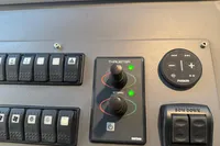 Control panel of a 2007 Astondoa 53 Open yacht with thruster and audio controls.