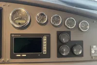 Control panel of a 2007 Astondoa 53 Open yacht with gauges and display.