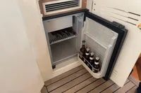 Mini fridge with beverages on Astondoa 53 Open yacht, 2007 model.