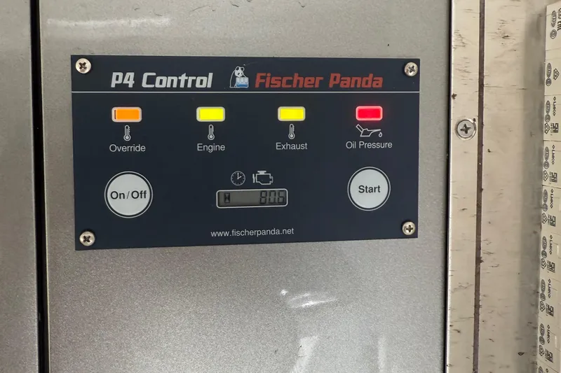  Yacht Photos Pics Control panel of Fischer Panda P4 with indicators for override, engine, exhaust, and oil pressure.