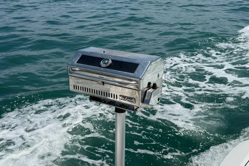  Yacht Photos Pics Stainless steel boat grill on a Schaefer 303, 2021, with ocean waves in the background.