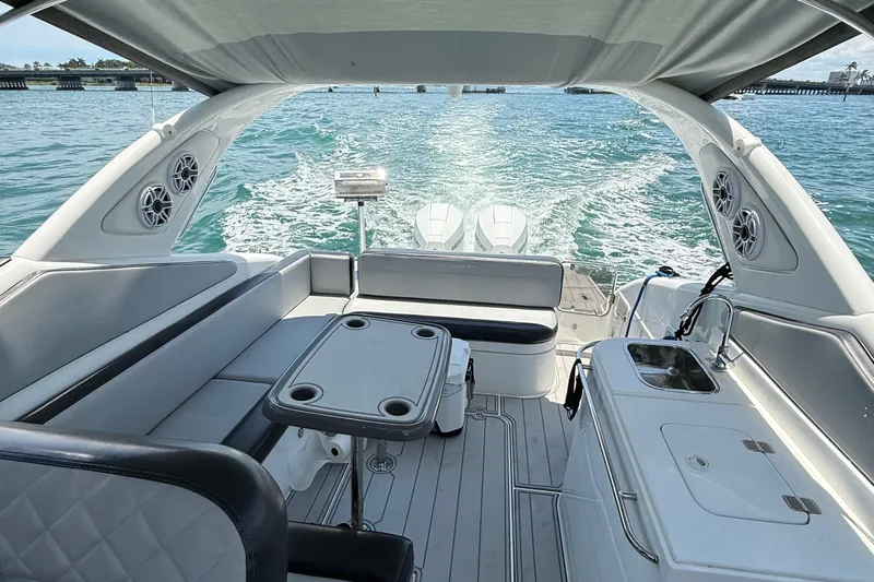  Yacht Photos Pics Luxurious 2021 Schaefer 303 yacht interior with seating, table, and ocean view.