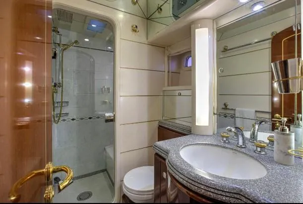 Sorcerer II Yacht Photos Pics Luxurious bathroom in 1998 Cookson Frers yacht with modern fixtures and elegant design.