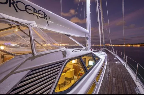 Sorcerer II Yacht Photos Pics Cookson Frers 1998 yacht at night, illuminated deck and cabin interior.