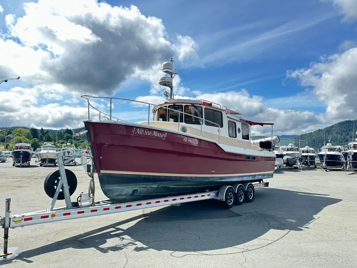  Yacht Photos Pics 2014 Ranger Tugs R-31S boat on trailer under cloudy sky at marina.