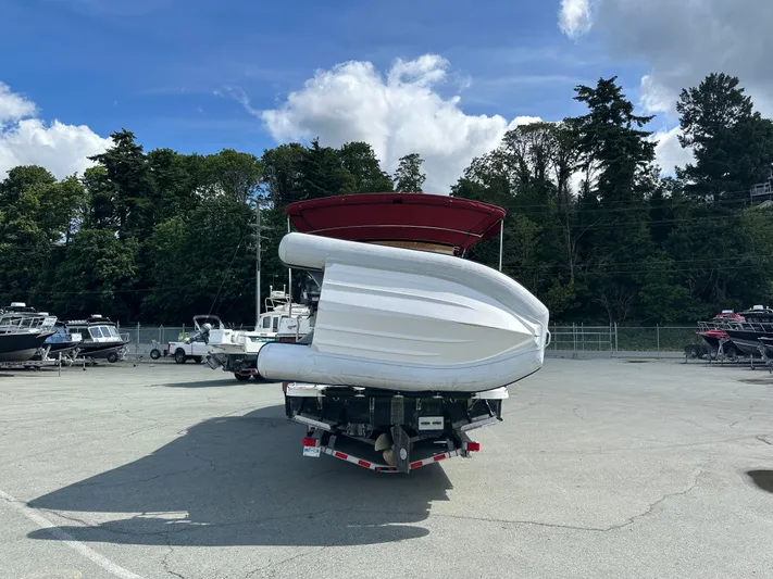  Yacht Photos Pics 2014 Ranger Tugs R-31S boat on trailer, surrounded by trees and other boats.
