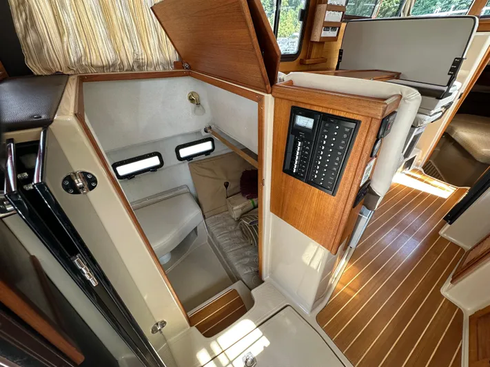  Yacht Photos Pics 2014 Ranger Tugs R-31S interior with compact bathroom and control panel.