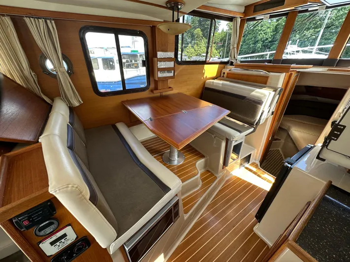  Yacht Photos Pics 2014 Ranger Tugs R-31S interior with wood accents and dining area.