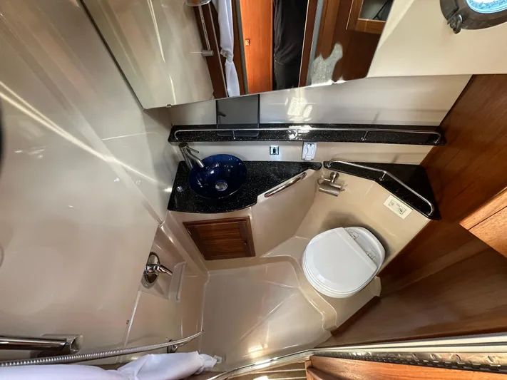  Yacht Photos Pics 2014 Ranger Tugs R-31S bathroom with modern fixtures, blue sink, and compact design.