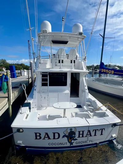 Bad Hatt Yacht Photos Pics 1999 Viking Conv Sport Fisher boat docked, named "Bad Hatt," Coconut Grove, FL.