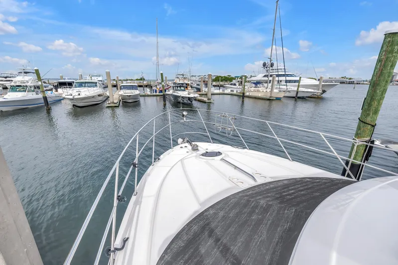 Yacht Photos Pics 2007 Meridian 459 Motoryacht docked in a marina with other boats.