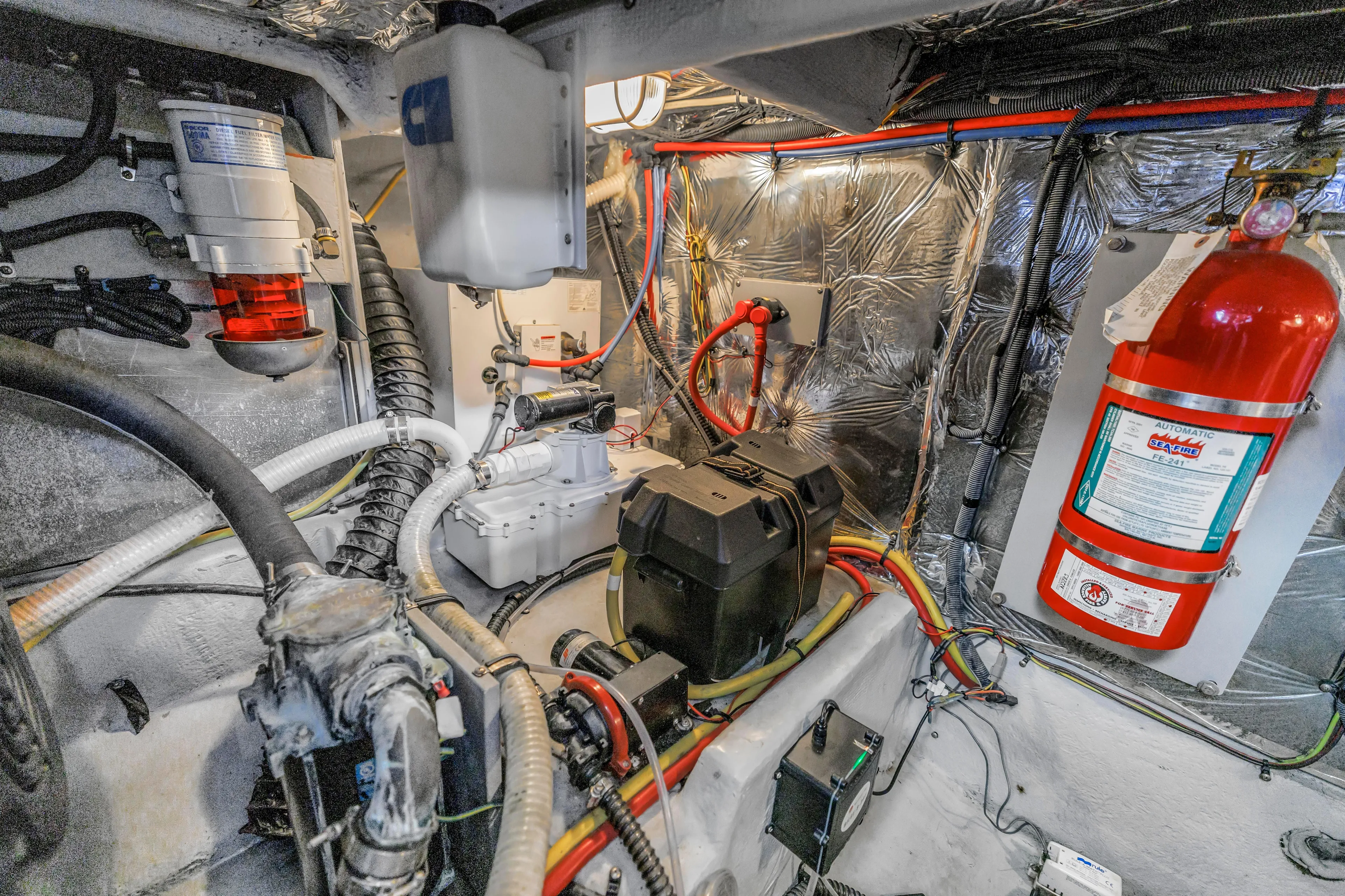 Yacht Photos Pics Engine room of 2007 Meridian 459 Motoryacht with fire extinguisher and wiring.