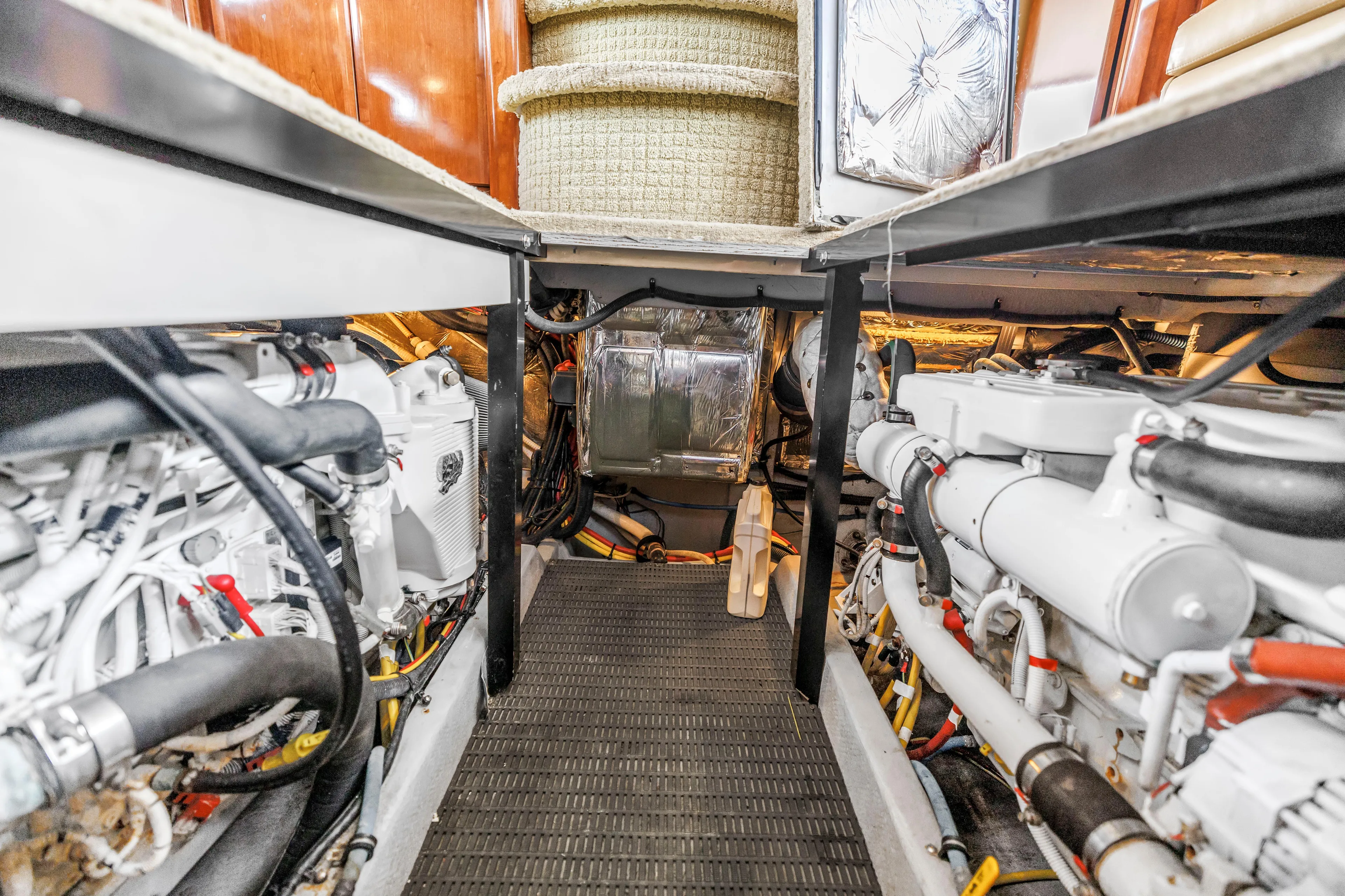  Yacht Photos Pics Engine room of 2007 Meridian 459 Motoryacht, showcasing dual engines and mechanical components.