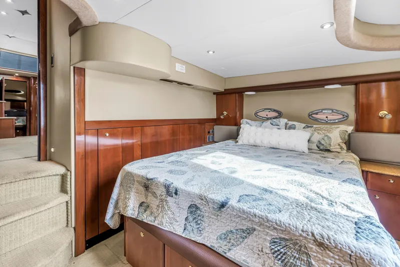  Yacht Photos Pics Luxurious bedroom interior of 2007 Meridian 459 Motoryacht with elegant wood finishes.