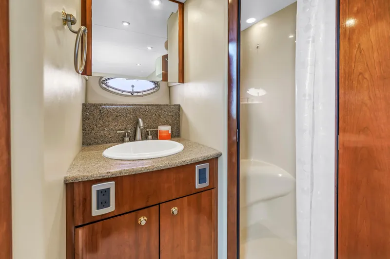  Yacht Photos Pics Luxurious bathroom in 2007 Meridian 459 Motoryacht with granite countertop and modern fixtures.