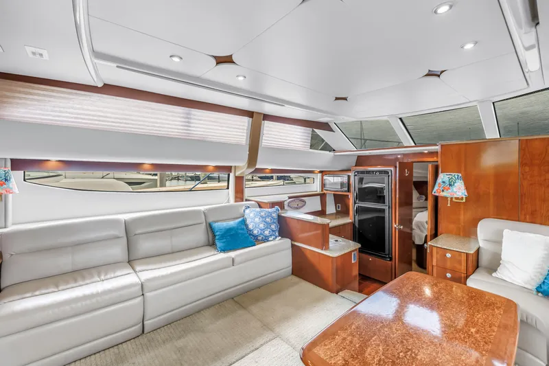  Yacht Photos Pics Luxurious interior of 2007 Meridian 459 Motoryacht with plush seating and elegant wood finishes.