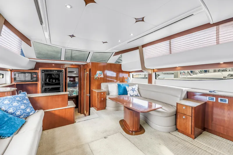  Yacht Photos Pics Luxurious interior of 2007 Meridian 459 Motoryacht with elegant wood finishes and plush seating.