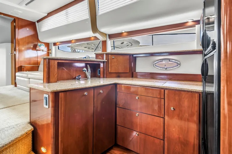  Yacht Photos Pics Luxurious interior of 2007 Meridian 459 Motoryacht with elegant wood cabinetry and modern amenities.