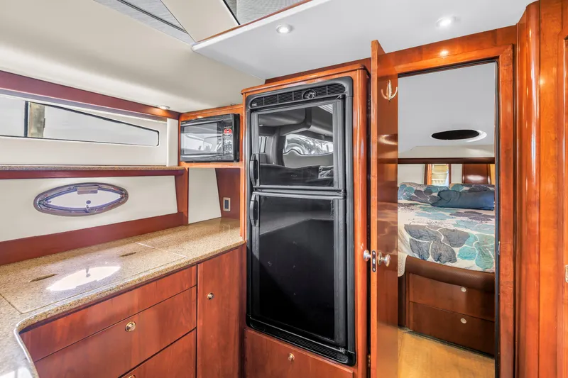  Yacht Photos Pics Luxurious interior of 2007 Meridian 459 Motoryacht with wood cabinetry and modern amenities.