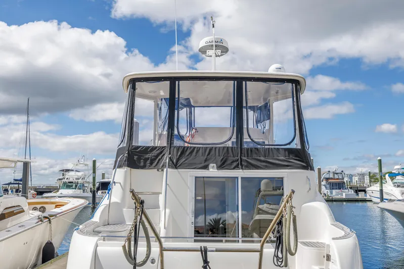  Yacht Photos Pics 2008 Meridian 459 Motoryacht docked at marina under blue sky.