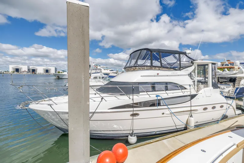  Yacht Photos Pics 2008 Meridian 459 Motoryacht docked at marina under blue sky.