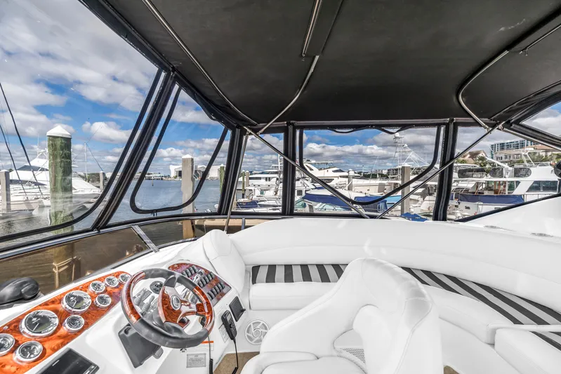  Yacht Photos Pics 2008 Meridian 459 Motoryacht helm with luxurious seating and marina view.