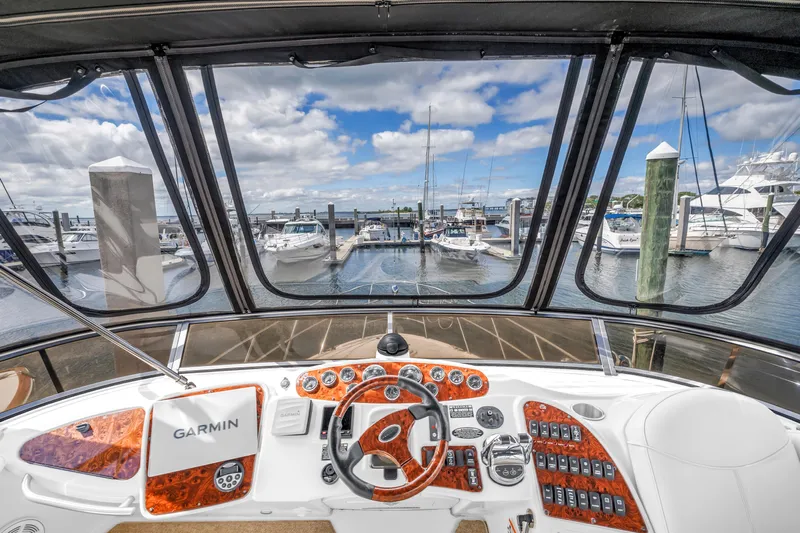  Yacht Photos Pics 2008 Meridian 459 Motoryacht helm with Garmin navigation, overlooking marina with docked boats.