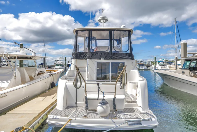  Yacht Photos Pics 2008 Meridian 459 Motoryacht docked at marina under blue sky.