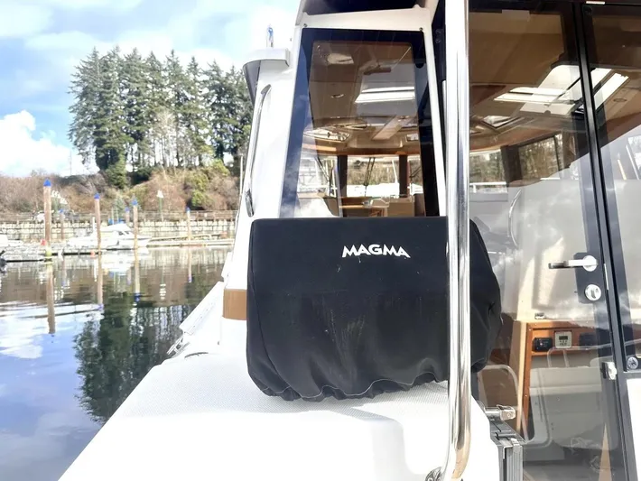  Yacht Photos Pics 2015 Ranger Tugs R-29S boat docked, featuring a covered Magma grill on deck.