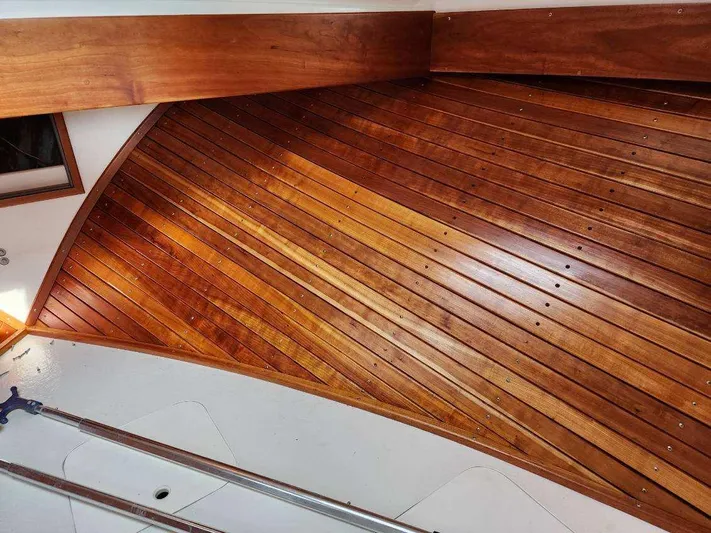  Yacht Photos Pics Wooden interior of 2016 Custom Broad Creek 32 Downeast boat, showcasing polished craftsmanship.