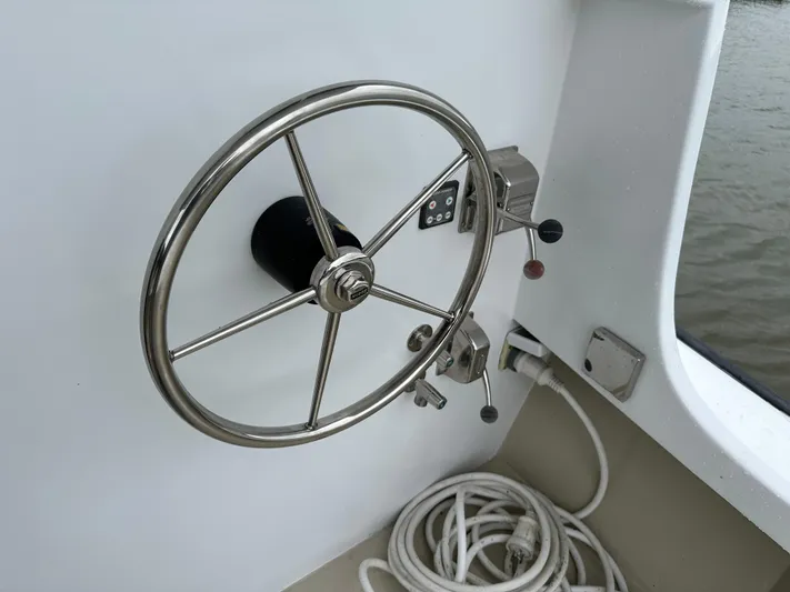  Yacht Photos Pics Stainless steel steering wheel on 2016 Custom Broad Creek 32 Downeast boat.