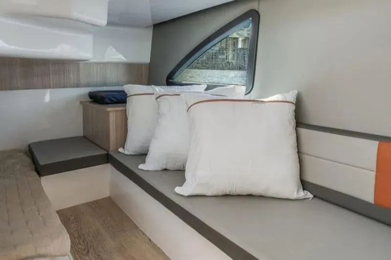  Yacht Photos Pics Interior of 2025 Hanover 377 boat with modern seating and cushions.