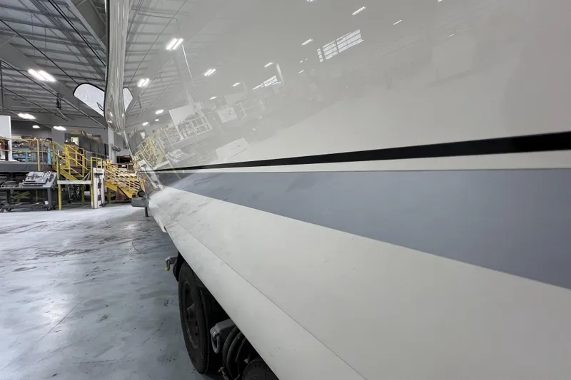  Yacht Photos Pics 2025 Scout 530 LXF boat in a spacious indoor facility.