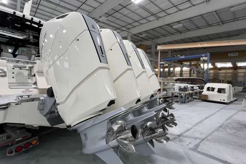  Yacht Photos Pics 2025 Scout 530 LXF boat engines in a manufacturing facility.