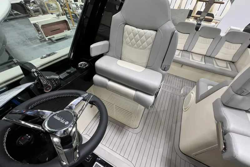  Yacht Photos Pics 2025 Scout 530 LXF boat interior with luxury seating and modern steering wheel.