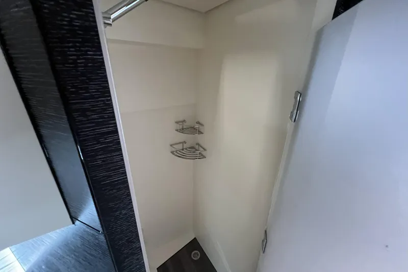  Yacht Photos Pics Interior shower area of 2025 Scout 530 LXF boat with modern fixtures.