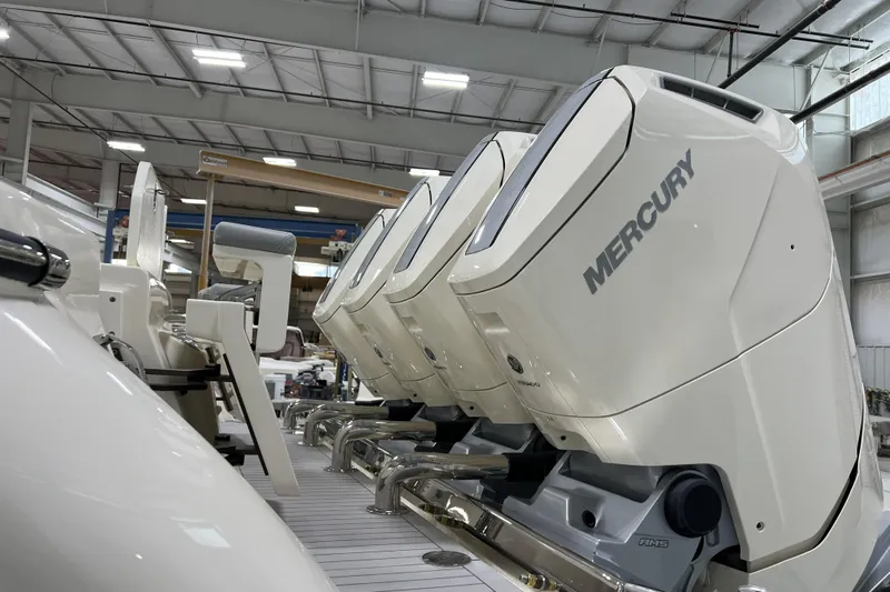  Yacht Photos Pics 2025 Scout 530 LXF with Mercury outboard engines in a boat manufacturing facility.