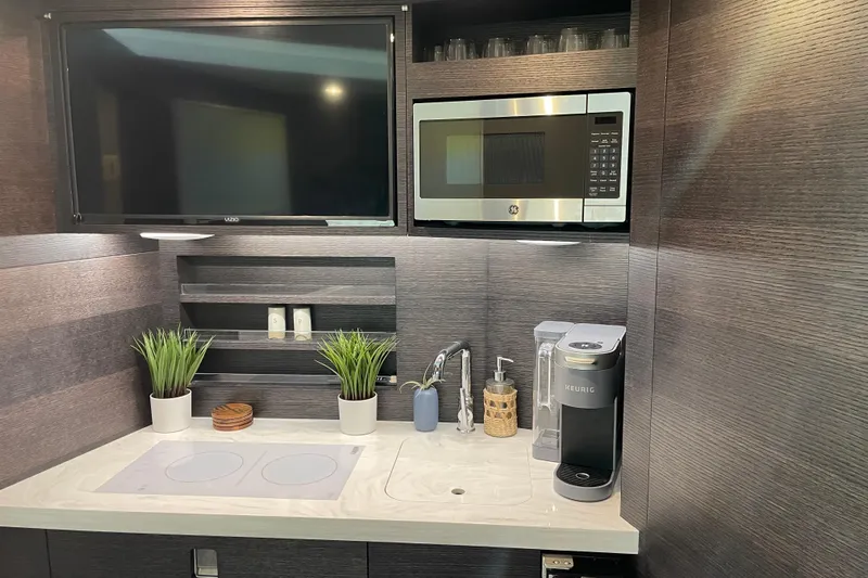  Yacht Photos Pics Modern kitchen area in 2025 Scout 530 LXF yacht with appliances and decor.