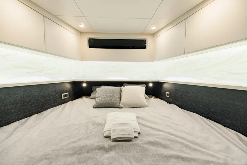  Yacht Photos Pics Luxurious cabin interior of 2025 Scout 530 LXF yacht with cozy bedding.