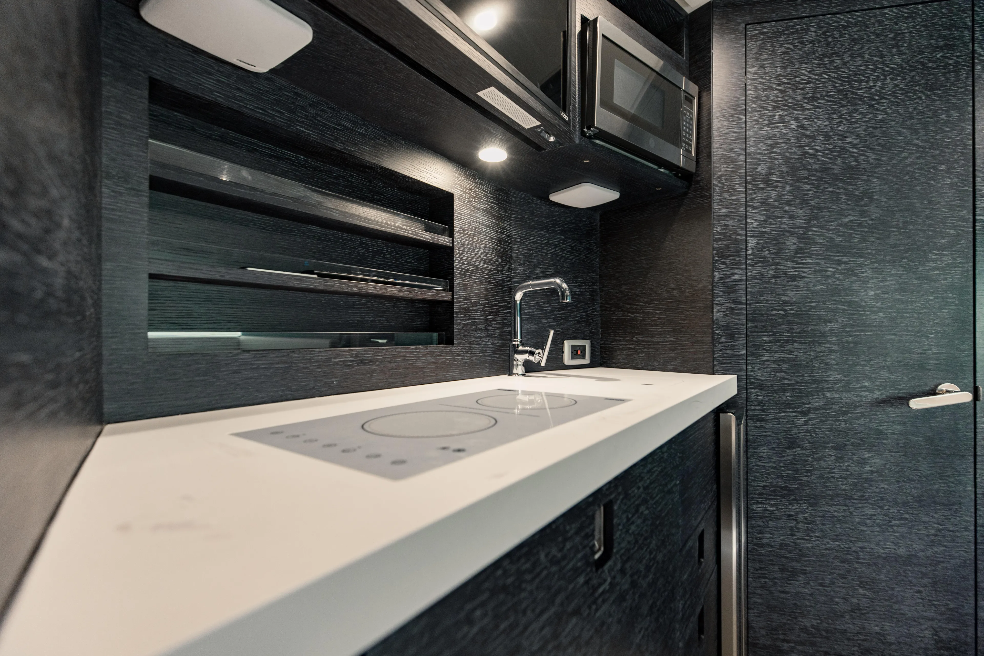  Yacht Photos Pics Modern kitchen interior of 2025 Scout 530 LXF yacht with sleek design and appliances.