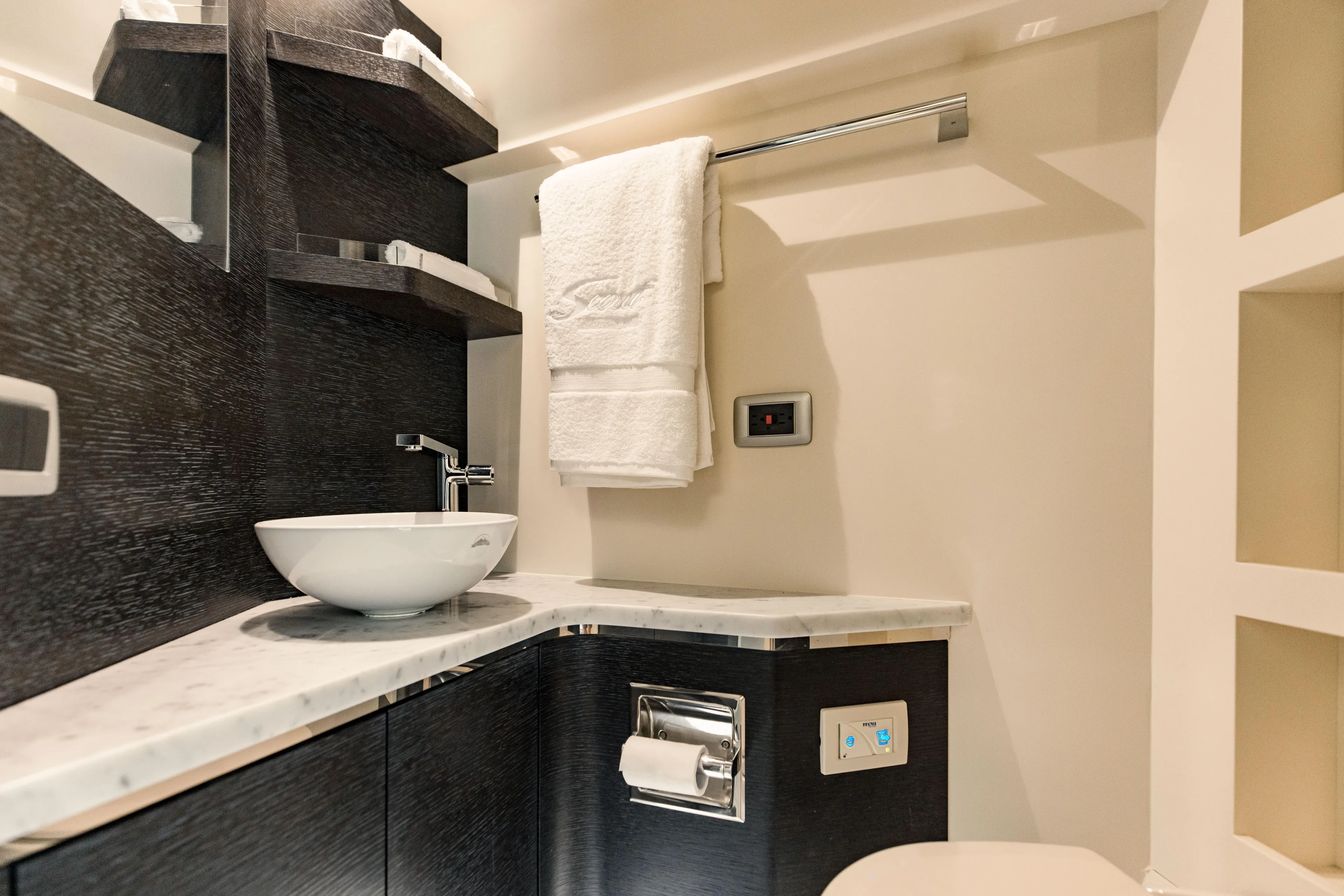  Yacht Photos Pics Luxurious bathroom interior of 2025 Scout 530 LXF yacht with modern sink and towel rack.