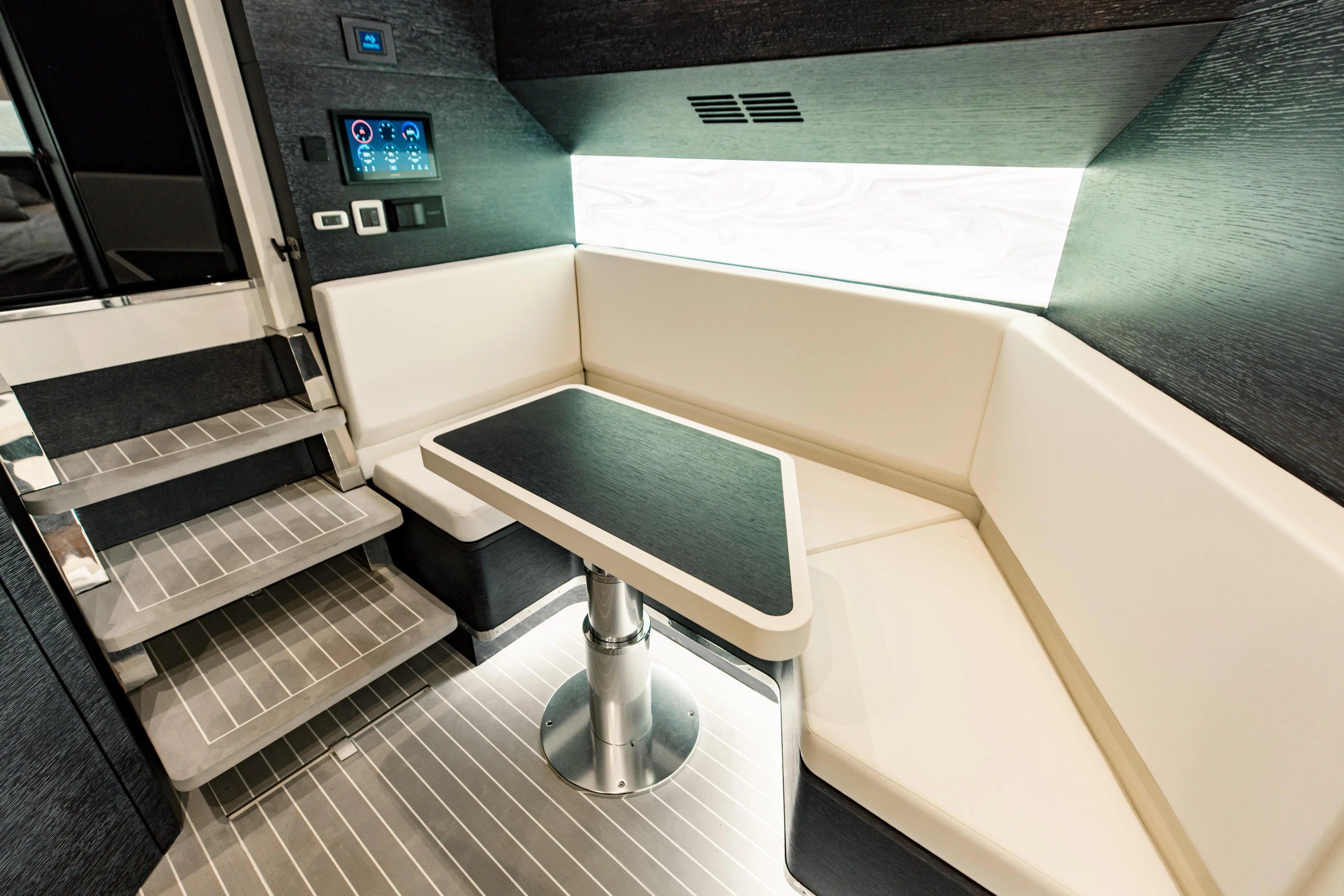  Yacht Photos Pics Luxurious interior of 2025 Scout 530 LXF yacht with modern seating and table.