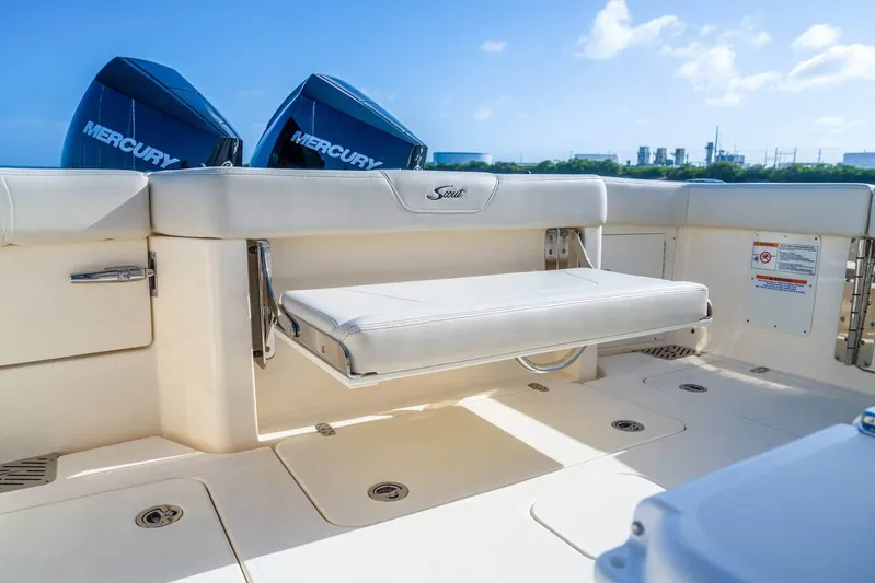  Yacht Photos Pics 2026 Scout 288 LXF boat interior with foldable seat and Mercury engines.