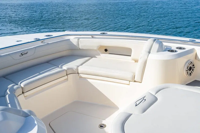  Yacht Photos Pics Luxurious seating on 2026 Scout 288 LXF boat, overlooking serene blue waters.