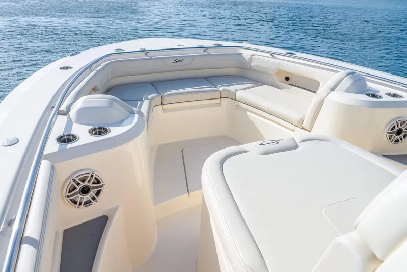  Yacht Photos Pics 2026 Scout 288 LXF boat interior with luxurious seating and ocean view.
