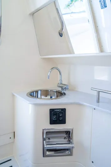  Yacht Photos Pics 2026 Scout 288 LXF boat interior with sink and storage.