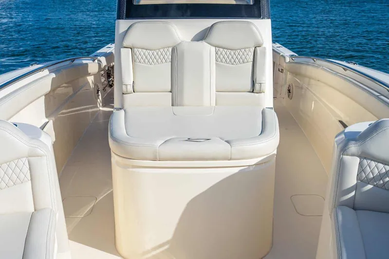  Yacht Photos Pics 2026 Scout 288 LXF boat interior with luxurious seating and ocean backdrop.