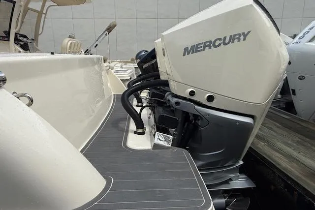  Yacht Photos Pics 2026 Scout 288 LXF boat with Mercury outboard engine, docked and ready for adventure.