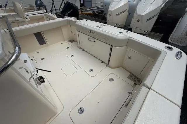  Yacht Photos Pics 2026 Scout 288 LXF boat deck with storage compartments and Mercury engines.