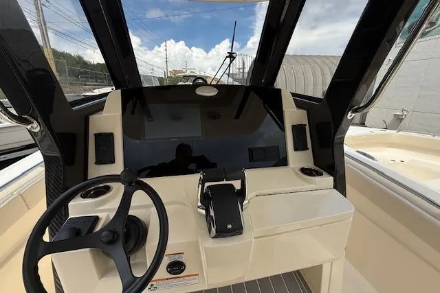  Yacht Photos Pics 2026 Scout 288 LXF boat dashboard with steering wheel and controls.